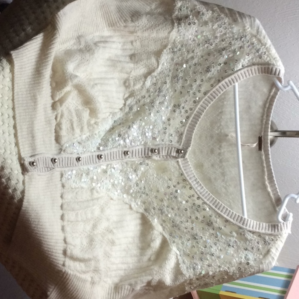 Free people brand.  Embellished crop top sweater